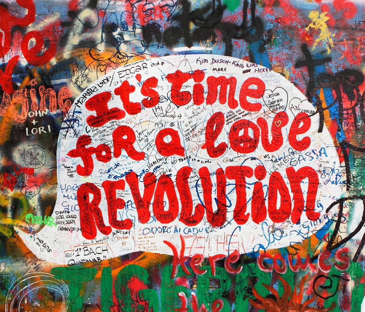 Graffiti art calling for a love revolution with vibrant colors.